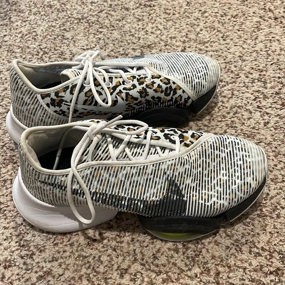 White and silver hot sale cheetah nike shoes